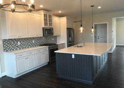 Kitchen cabinet and island installation by Hauptman Builders
