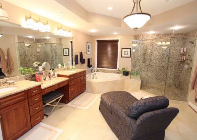 Wide bathroom design with standing shower and tub and makeup area
