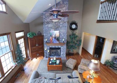 Family room with stone fireplace column