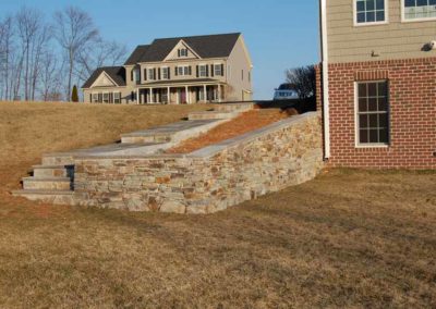 Stone pathway and steps outside a home | Hauptman Builders