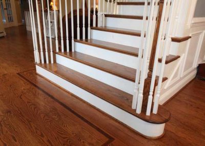 Hardwood flooring and staircase with wooden steps | Hauptman Builders