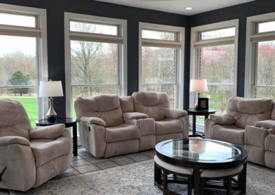 Sunroom with recliner chairs | Hauptman Builders