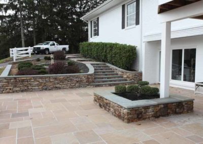 Side walkway of white custom home | Hauptman Builders