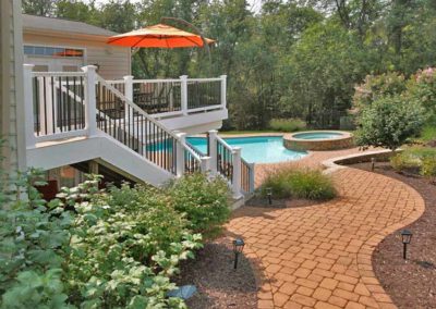 Outdoor pool house and walkway | Hauptman Builders